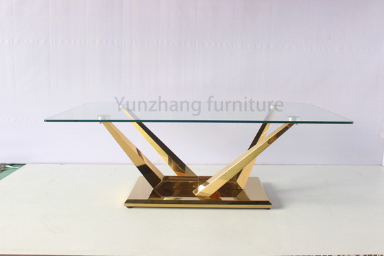 Mesa de comedor de vidrio transparente rectangular Muebles de acero inoxidable con base dorada