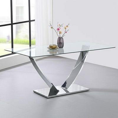 Mesa de comedor rectangular con vidrio transparente y base simple