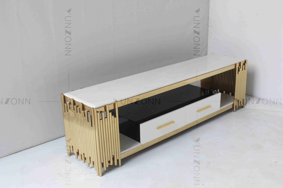 El blanco de la sala de estar y la tabla de consola del oro TV vetean el acero inoxidable superior con los cajones