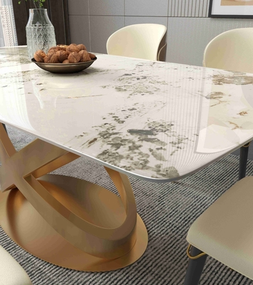 La silla de mesa de comedor de piedra rectangular blanca fija los pedestales de bronce