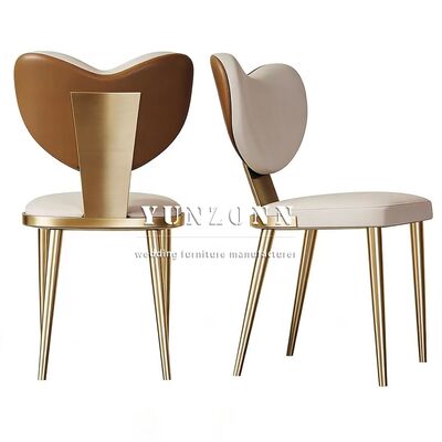 Buen precio Hermosa silla de cuero en forma de corazón Villa de lujo Muebles de comedor Exquisitos pies de metal silla de comedor en línea