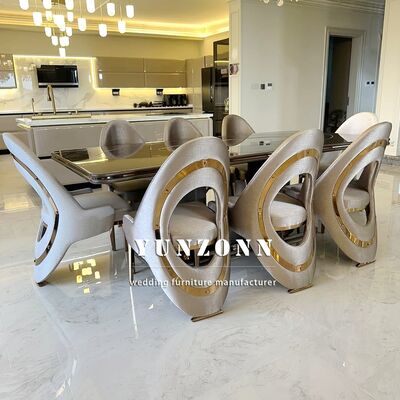 Buen precio Silla de comedor de lujo de oro de estilo italiano nórdico moderno ligero de lujo con piernas de acero inoxidable silla de comedor de terciopelo / cuero para villa en línea