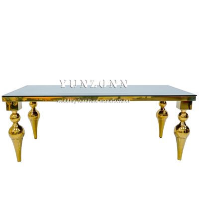 Buen precio Fábrica de Foshan Precio barato Muebles de comedor de hotel Oro de acero inoxidable Espejo de vidrio Mesa de mesa de boda en línea