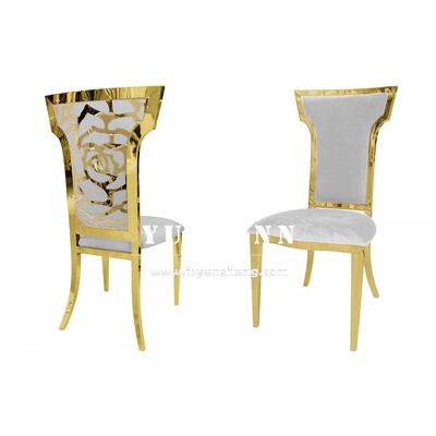 Buen precio Silla de comedor de metal dorado para bodas con respaldo de patrón floral, moderna y lujosa en línea
