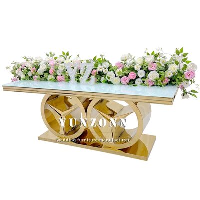 Buen precio Mesa de comedor rectangular moderna dorada con base Benz, muebles de lujo para bodas y eventos para uso en exteriores y hoteles, tapa de vidrio/MDF en línea